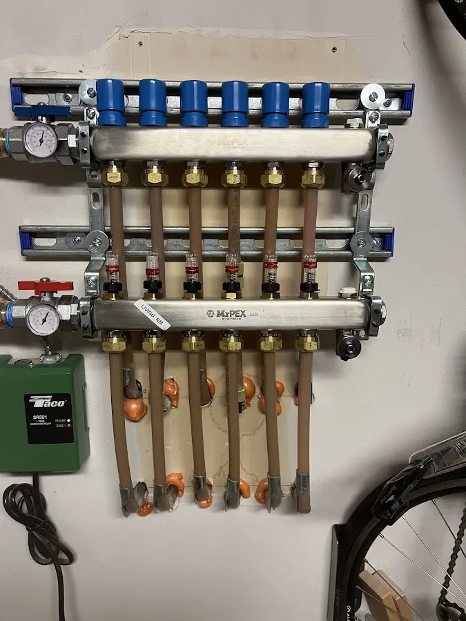 Plumber performing Water Heater Repair at a residential property in Topsfield